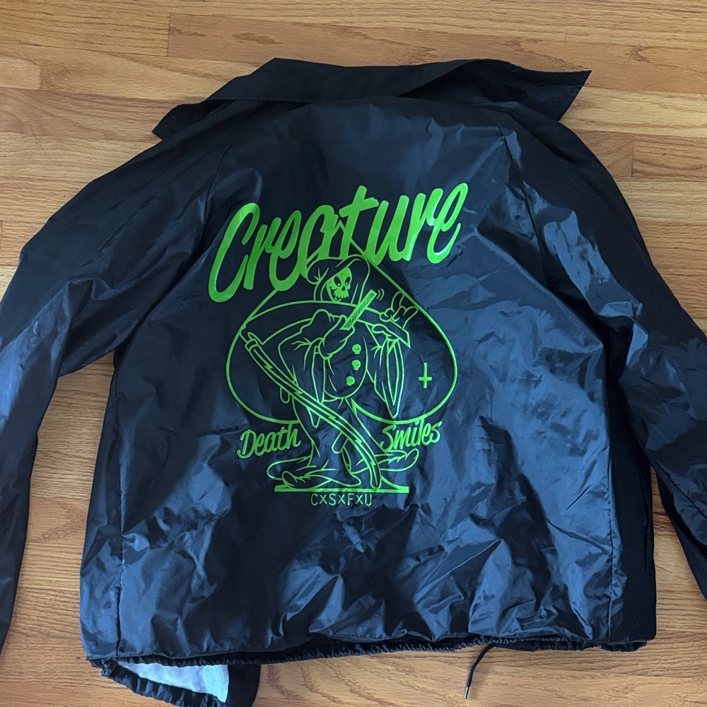Creature Black Windbreaker Jacket with Neon Green Graphic